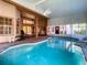 Inviting screened pool area with spa at 216 Ocean Dr, New Smyrna Beach, FL 32169