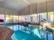 Enclosed pool and spa with large windows at 216 Ocean Dr, New Smyrna Beach, FL 32169