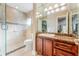 Clean bathroom with walk-in shower, granite vanity, and tiled floor at 311 Partridge Ln, Longwood, FL 32779