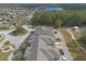 Aerial view of townhome community with green spaces, roads, and a pavilion at 3414 Medici Blvd, New Smyrna Beach, FL 32168