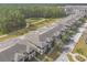 Aerial view of a residential community with townhomes and green spaces at 3414 Medici Blvd, New Smyrna Beach, FL 32168