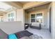 Spacious balcony with outdoor seating, large windows, and tiled floor at 3414 Medici Blvd, New Smyrna Beach, FL 32168