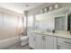 Bathroom with white vanity, neutral tile, and shower/tub combo at 3414 Medici Blvd, New Smyrna Beach, FL 32168