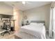 Bedroom featuring a workspace with a standing desk, a comfortable bed, and modern decor at 3414 Medici Blvd, New Smyrna Beach, FL 32168