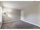 Empty bedroom with gray carpet and neutral walls at 3414 Medici Blvd, New Smyrna Beach, FL 32168