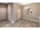 Dining area adjacent to the entryway, featuring a round mirror and tiled floors at 3414 Medici Blvd, New Smyrna Beach, FL 32168
