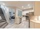 Modern kitchen with stainless steel appliances, white cabinets, and a view into the living area at 3414 Medici Blvd, New Smyrna Beach, FL 32168