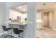 Modern kitchen with white cabinets, stainless steel appliances, and a breakfast bar at 3414 Medici Blvd, New Smyrna Beach, FL 32168
