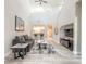 Spacious living room with high ceilings, a cozy sofa, and a view of the kitchen at 3414 Medici Blvd, New Smyrna Beach, FL 32168