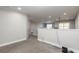 A spacious loft area with gray carpet, white walls, and recessed lighting at 3414 Medici Blvd, New Smyrna Beach, FL 32168