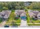 Aerial view of a house with a blue double garage door and landscaped front yard at 3769 Fiano Dr, Port Orange, FL 32129