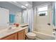 Bathroom with tub/shower combo, single vanity, and tile flooring and wainscoting at 3769 Fiano Dr, Port Orange, FL 32129