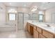 Spacious bathroom with double vanity, shower, bathtub, and tile flooring at 3769 Fiano Dr, Port Orange, FL 32129