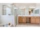 Spacious primary bathroom with dual vanities, separate tub, and glass-enclosed shower at 3769 Fiano Dr, Port Orange, FL 32129