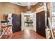Bonus room with wood floors, storage cabinets, and view to billiards room at 3769 Fiano Dr, Port Orange, FL 32129