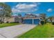 Exterior view of the home showcasing the double garage and driveway at 3769 Fiano Dr, Port Orange, FL 32129