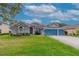 Attractive curb appeal with a neat lawn, landscaping, and a welcoming entrance at 3769 Fiano Dr, Port Orange, FL 32129