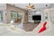 Spacious living room with a view of the pool through sliding glass doors and ample seating at 3769 Fiano Dr, Port Orange, FL 32129