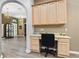 Home office or study area with built-in desk, cabinets, and natural light at 3769 Fiano Dr, Port Orange, FL 32129