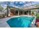Inviting pool area with screened enclosure, perfect for outdoor entertaining at 3769 Fiano Dr, Port Orange, FL 32129