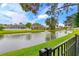 Waterfront property with canal, fountain, and houses with screened patios at 410 Central Mariners Dr, Edgewater, FL 32141