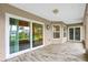 Covered patio with tile floors and sliding glass doors at 410 Central Mariners Dr, Edgewater, FL 32141