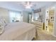 King bed, en-suite bathroom, and beachy decor at 4208 Sun Village Ct # 4208, New Smyrna Beach, FL 32169