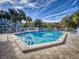 Community pool with lounge chairs and surrounding landscaping at 4208 Sun Village Ct # 4208, New Smyrna Beach, FL 32169