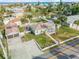 An aerial view of a charming beach house with a pool, two-car garage, and large front lawn at 4211 S Peninsula Dr, Port Orange, FL 32127