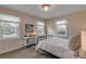 Charming bedroom with a metal bedframe, soft linens, and natural light at 4211 S Peninsula Dr, Port Orange, FL 32127