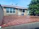 Large back patio with red tile flooring and access to the house at 4255 S Atlantic Ave, Port Orange, FL 32127