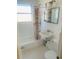Bathroom with shower/tub combo and white tile at 4255 S Atlantic Ave, Port Orange, FL 32127