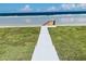 Walkway to beach with grassy area at 4255 S Atlantic Ave, Port Orange, FL 32127