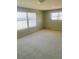 Bedroom with carpet flooring and ocean views from two windows at 4255 S Atlantic Ave, Port Orange, FL 32127