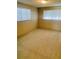 Spacious carpeted bedroom with two windows at 4255 S Atlantic Ave, Port Orange, FL 32127