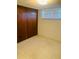 Bedroom with wood paneling and carpet at 4255 S Atlantic Ave, Port Orange, FL 32127