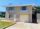 Tan house with attached garage and ocean view at 4255 S Atlantic Ave, Port Orange, FL 32127