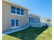 House with large windows and a patio overlooking the ocean at 4255 S Atlantic Ave, Port Orange, FL 32127