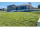 House with large windows and a patio overlooking the ocean at 4255 S Atlantic Ave, Port Orange, FL 32127