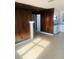 Simple kitchen with wood paneling and white appliances at 4255 S Atlantic Ave, Port Orange, FL 32127