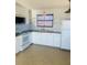 White kitchen with wood accents and retro appliances at 4255 S Atlantic Ave, Port Orange, FL 32127