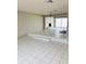 Living room with fireplace and large windows overlooking the water at 4255 S Atlantic Ave, Port Orange, FL 32127