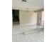 Bright living room with tiled floors and a view of the staircase at 4255 S Atlantic Ave, Port Orange, FL 32127