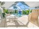 Inviting pool area with a covered patio, lounge chairs, and outdoor shower at 4324 Candlewood Ln, Ponce Inlet, FL 32127