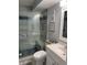 Bathroom with walk-in shower, toilet and vanity at 4501 S Atlantic Ave # 1150, New Smyrna Beach, FL 32169