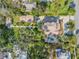 Aerial view showing house, pool, and lush landscaping at 4946 Halifax Dr, Port Orange, FL 32127