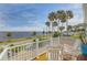 Relaxing balcony with white chairs overlooking the waterfront at 4946 Halifax Dr, Port Orange, FL 32127
