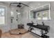Modern bathroom with double vanity, glass shower, and hexagon tile floor at 4946 Halifax Dr, Port Orange, FL 32127