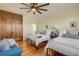 Guest bedroom with two twin beds and hardwood floors at 4946 Halifax Dr, Port Orange, FL 32127