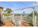 Relaxing waterfront deck with rocking chairs at 4946 Halifax Dr, Port Orange, FL 32127